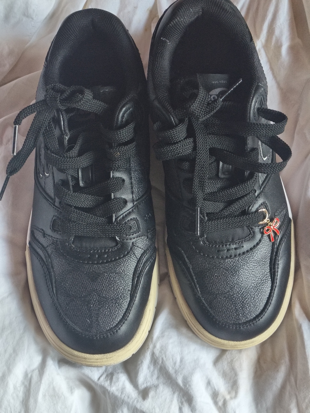 Coach Black Sneakers with Cream Soles Red Bow Shoe Charm Worn 1 Time.
